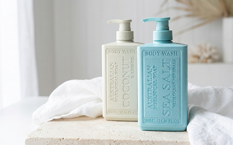 Australian Botanical Soap Sea Salt and Coconut & Lime Oil body wash bottles on a stone counter with a neutral light background.