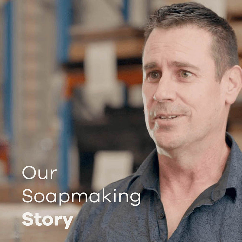 Man in a workshop with text 'Our Soapmaking Story'