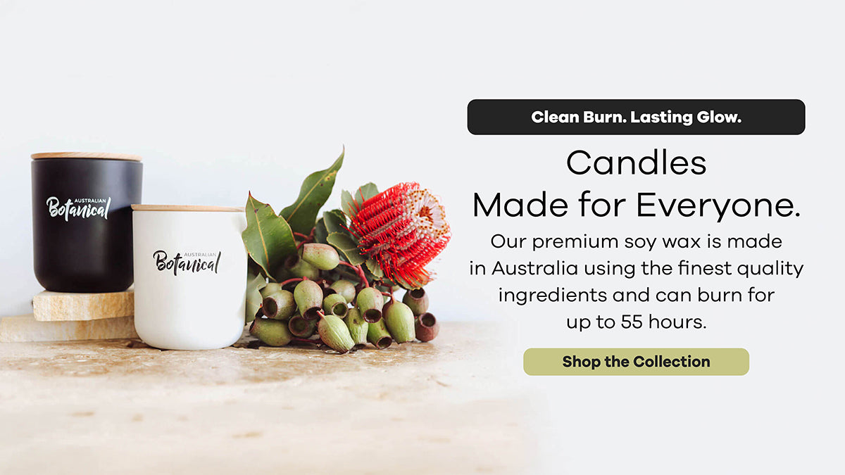 Two candles on a wooden surface with decorative elements and promotional text about candle quality and burn time.