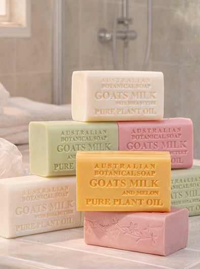 Collection of Australian Botanical Soap bars with various colors on a bathroom counter.