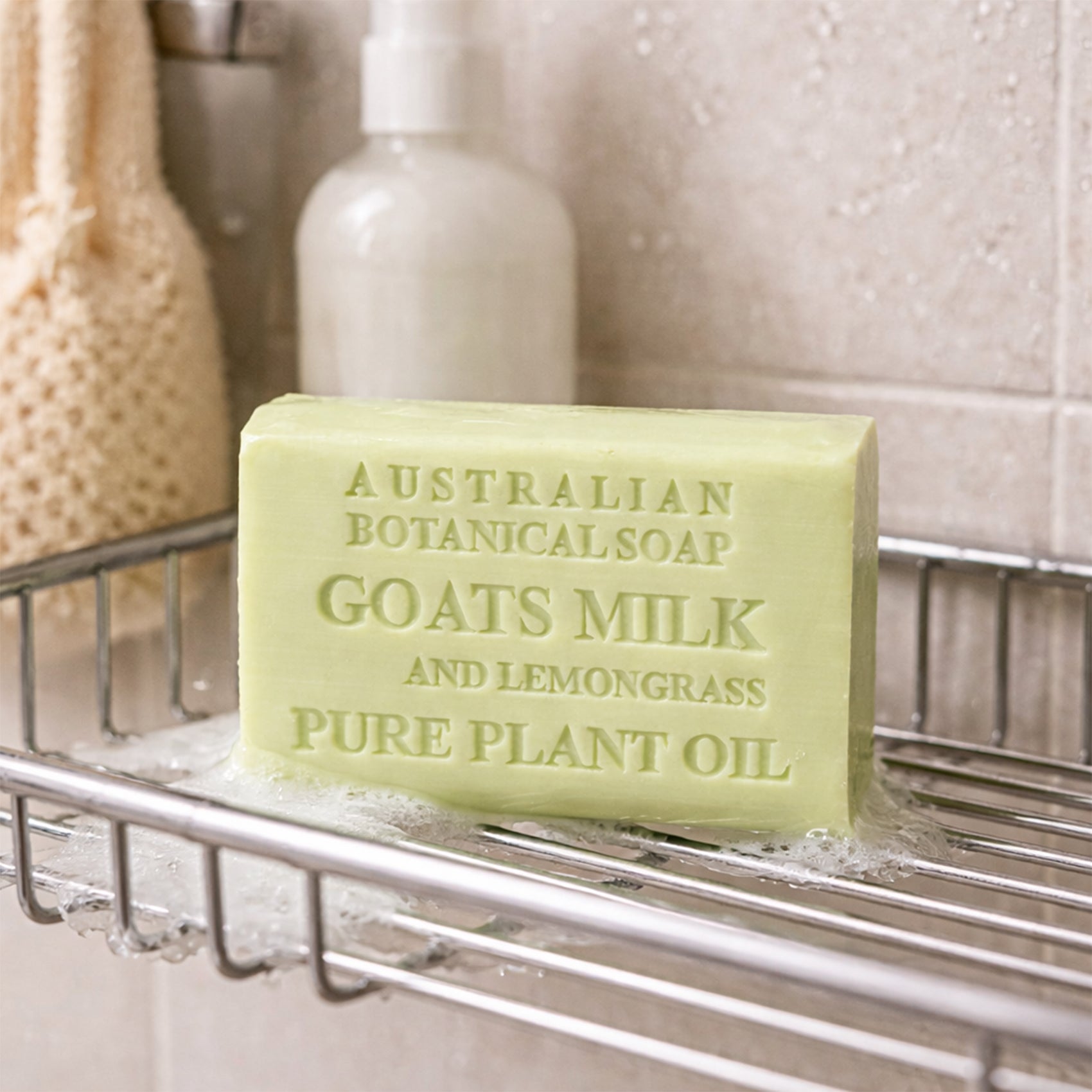 Bar of soap labeled 'Australian Botanical Soap' with ingredients on a soap dish.