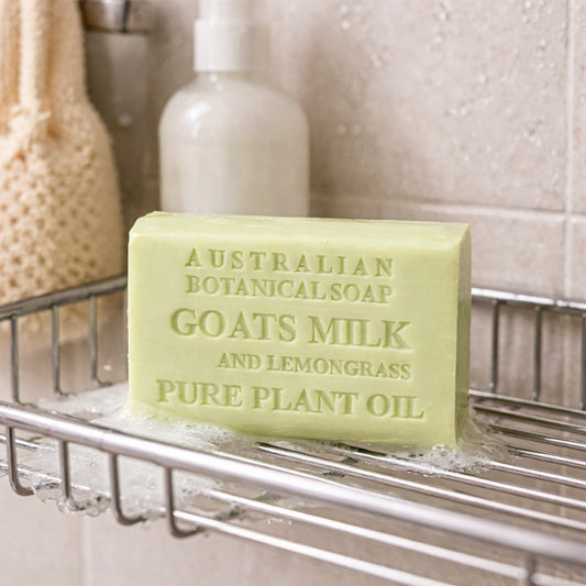 Bar of soap labeled 'Australian Botanical Soap' with ingredients on a soap dish.