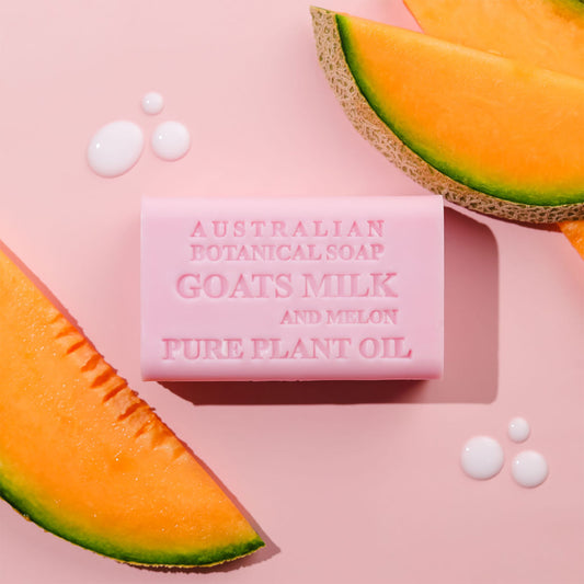 Bar of Australian Botanical Soap with goat's milk and melon on a pink background