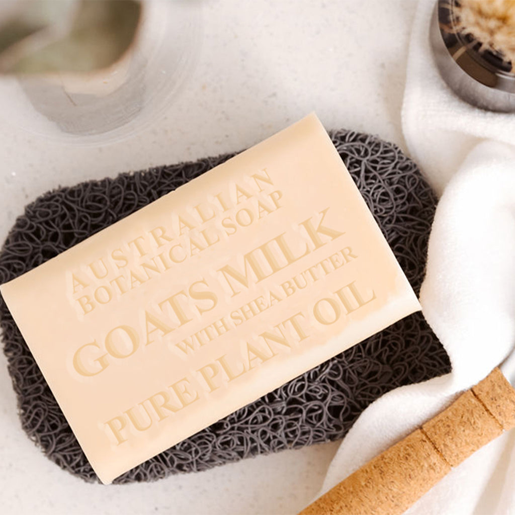 Bar of soap with text on a textured surface