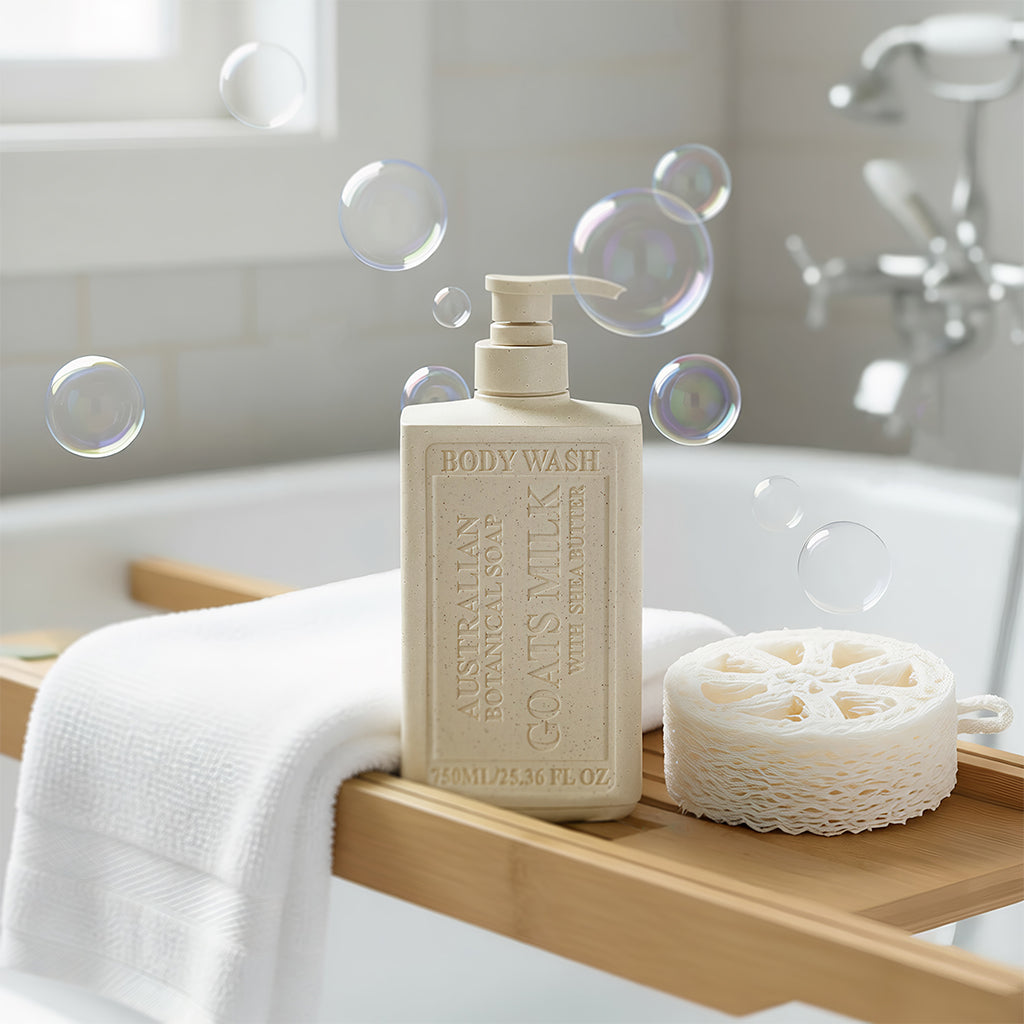 Goats Milk with Shea Butter body wash bottle on wooden tub shelf with bubbles and loofah