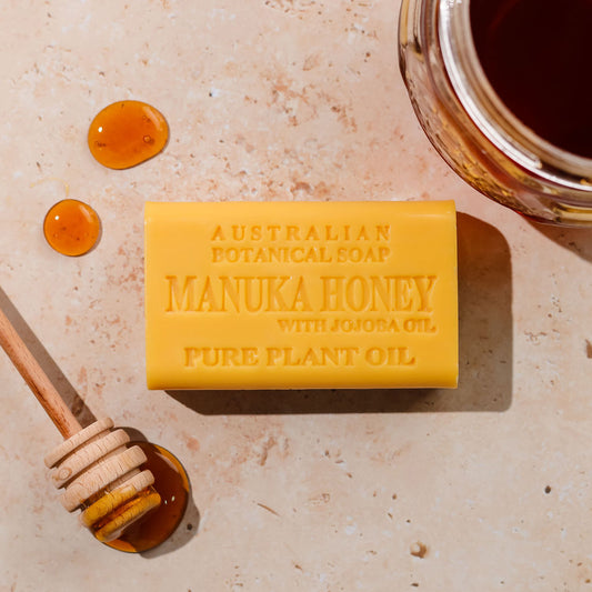 Bar of Australian Botanical Soap with honey on a textured background