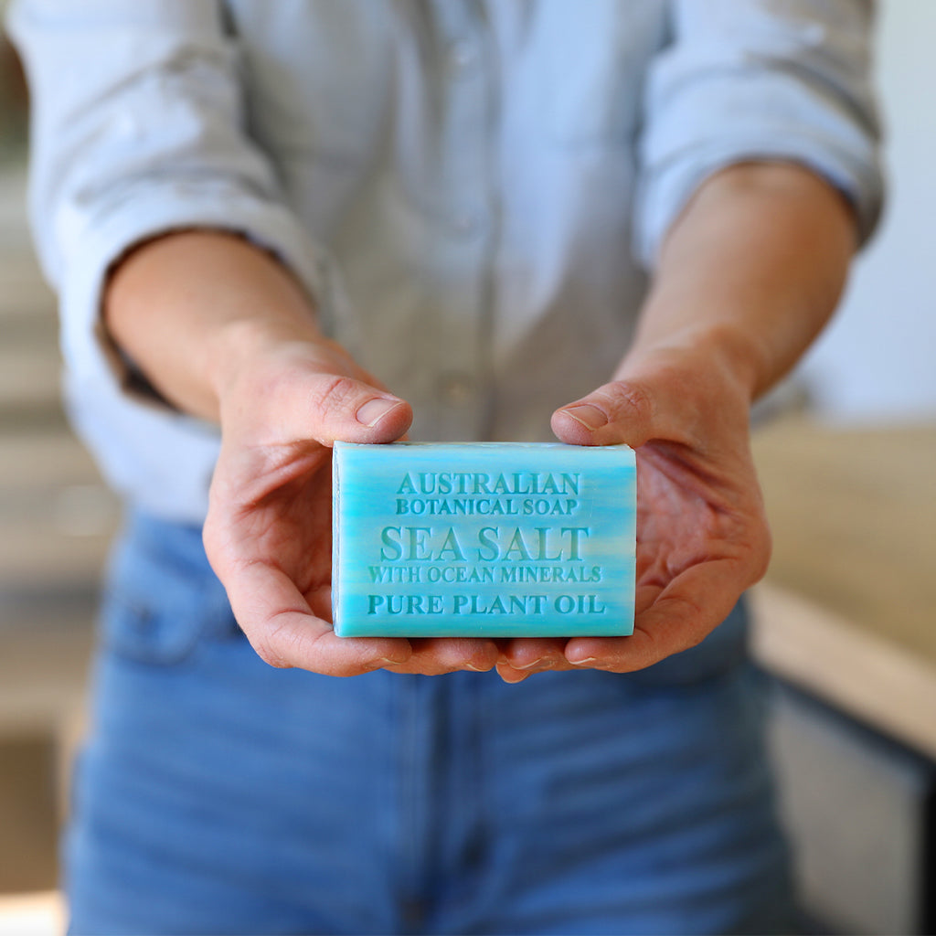 Person holding a bar of Australian Botanicals Sea Salt soap.