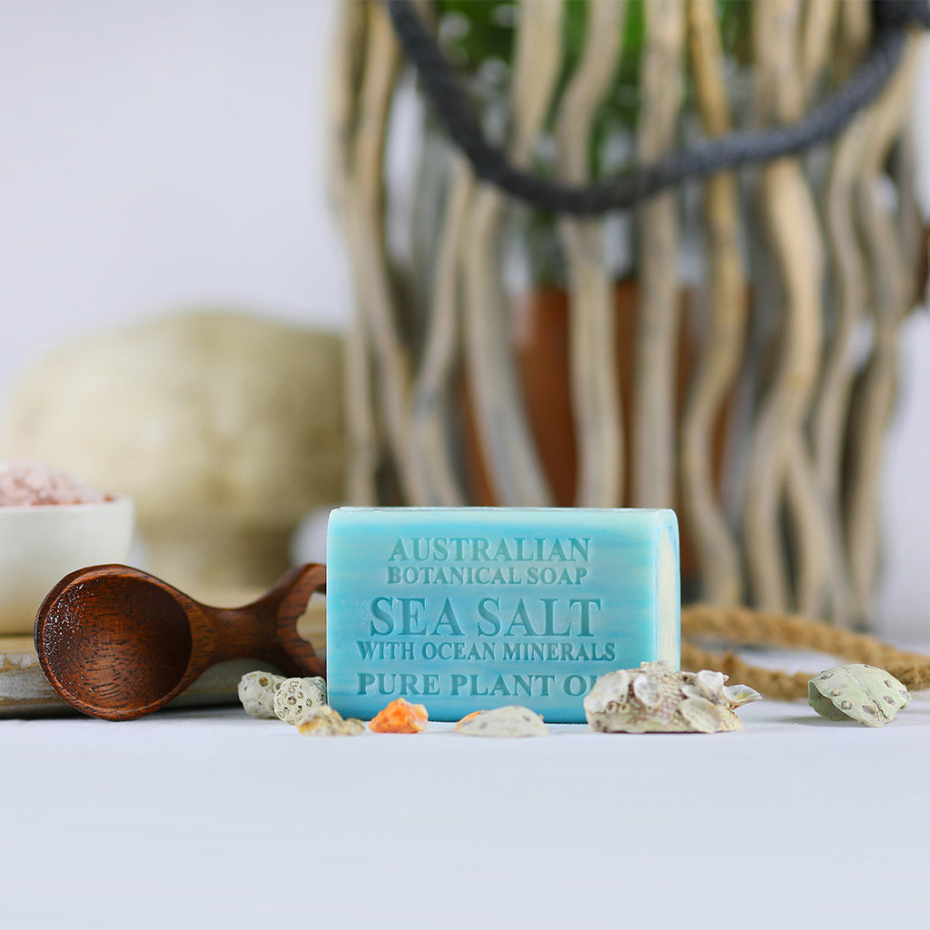 Bar of Australian Botanical Soap with Sea Salt on a white surface with decorative elements.