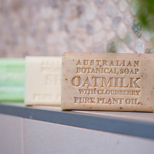 Bar of Australian Botanical Soap with Oatmilk and Cloudberry on a bathroom counter.