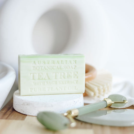 Bar of soap with a label on a white surface with a blurred background