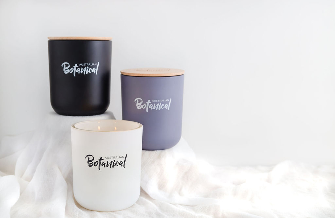 Coconut and Lime, Vanilla Caramel, and Sweet Sandalwood Soy Candles on table