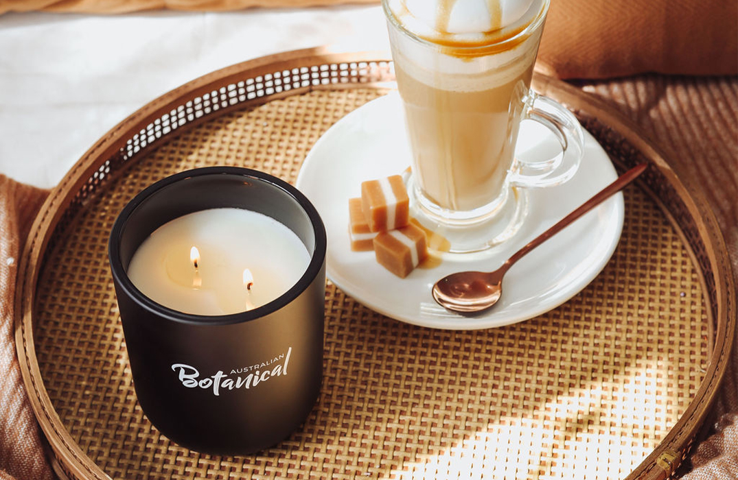 Sweet Sandalwood Soy Candle on table with fancy coffee